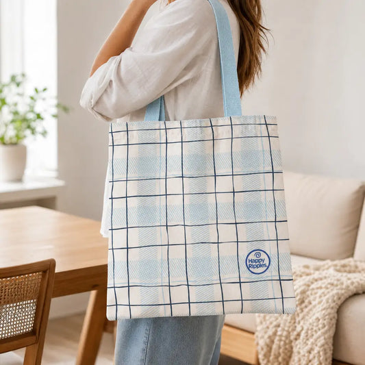 Happy Ripples plaid tote bag carried over shoulder in a bright home setting.