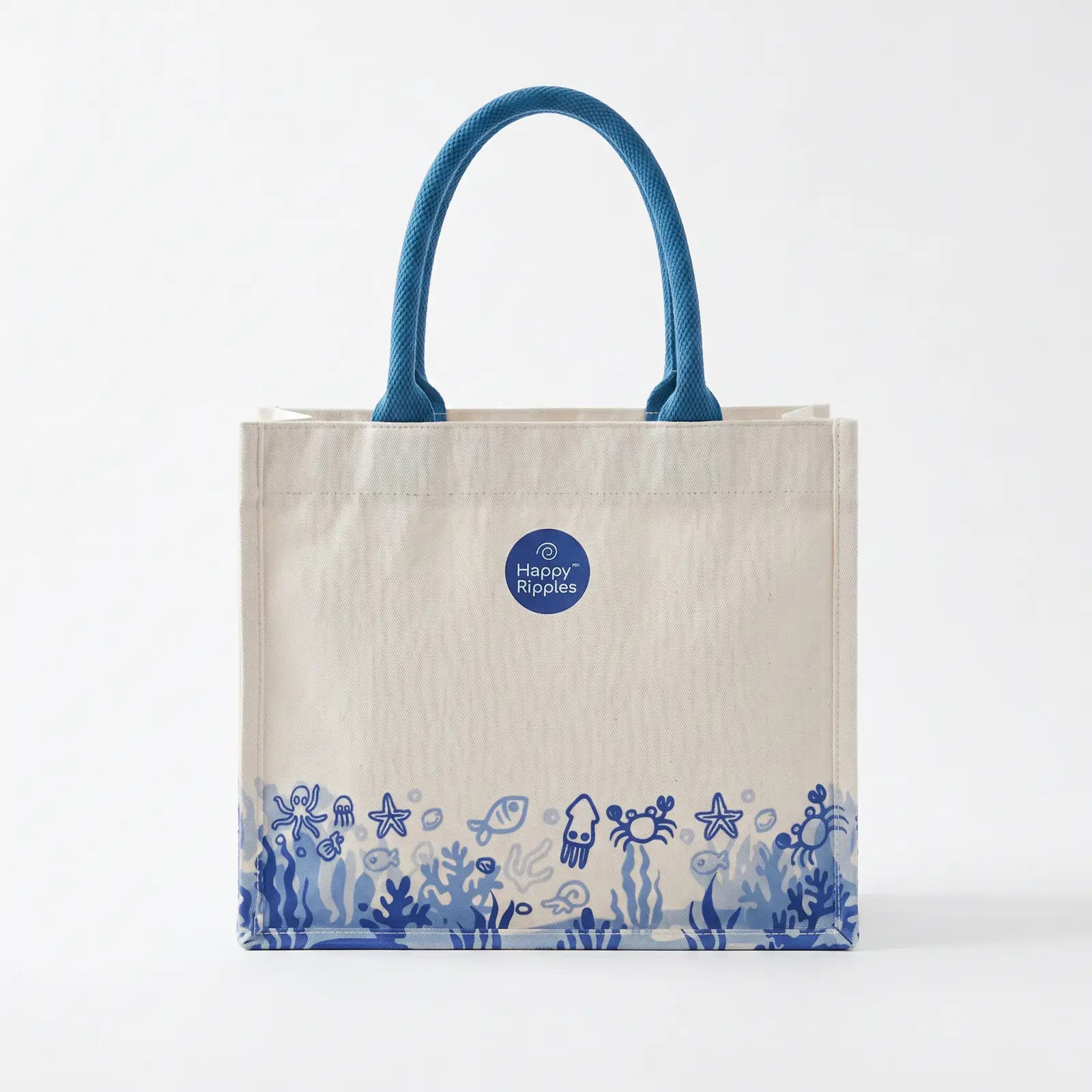 Happy Ripples ocean-print tote bag displayed on white background.
