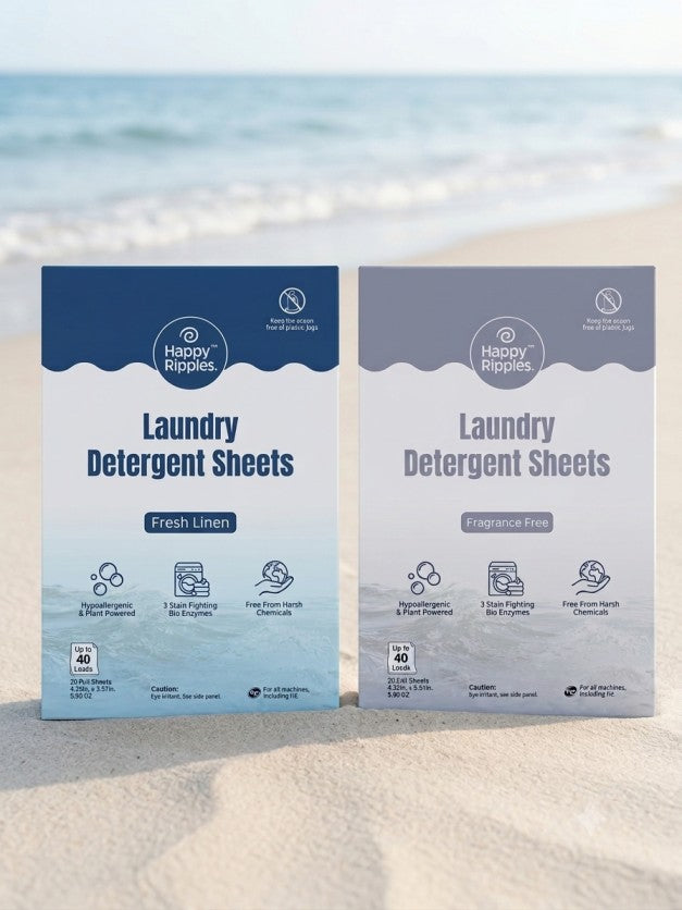 Happy Ripples Fresh Linen and Fragrance Free laundry detergent sheets boxes on a beach