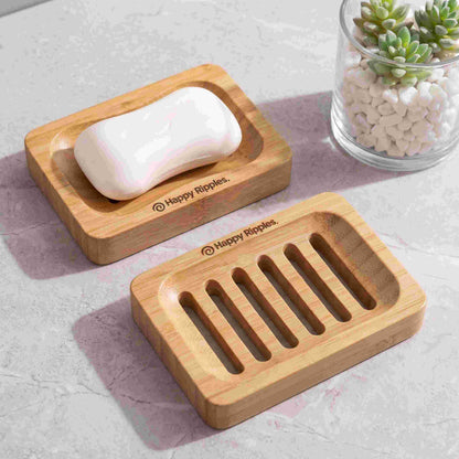 A soap bar displayed with a wooden soap holder and matching draining tray